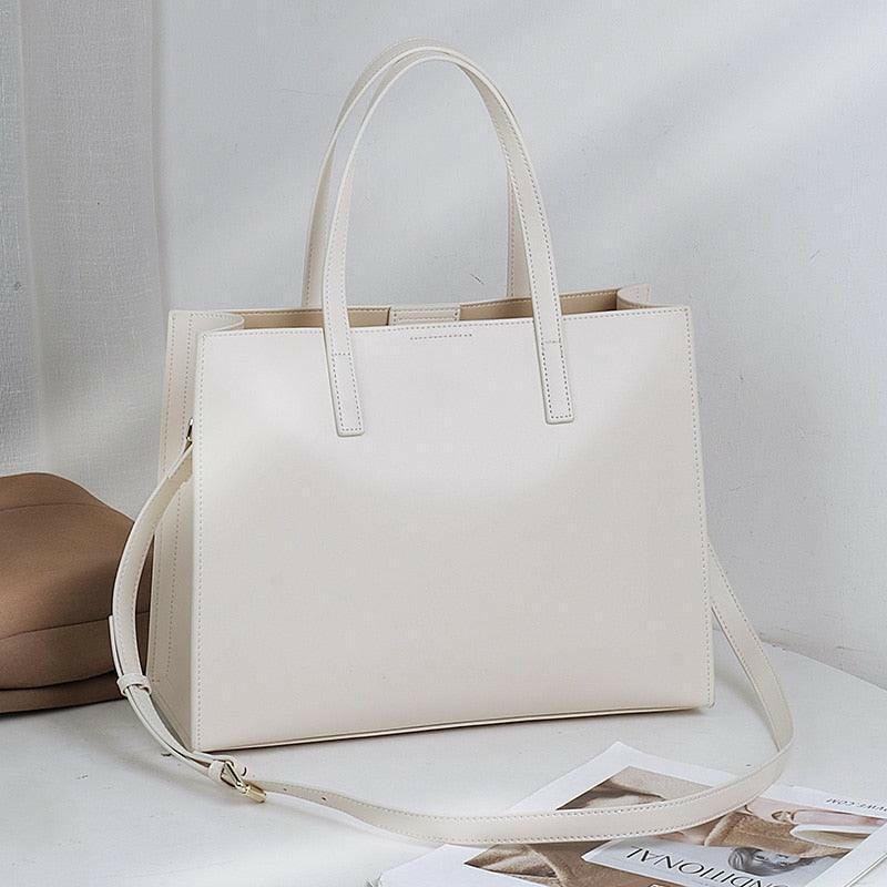 Classic Leather Handbag with Timeless Design and Spacious Interior White